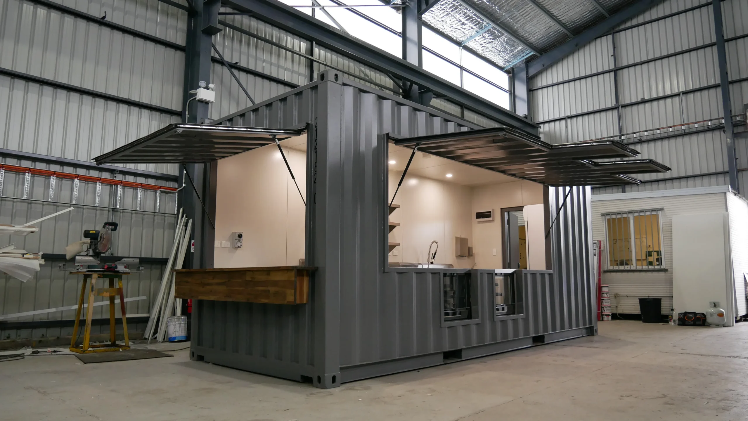 Instagrammable Outdoor Cafe Design Using Modified Containers 8 Custom Cafe with Display Cabinets 1