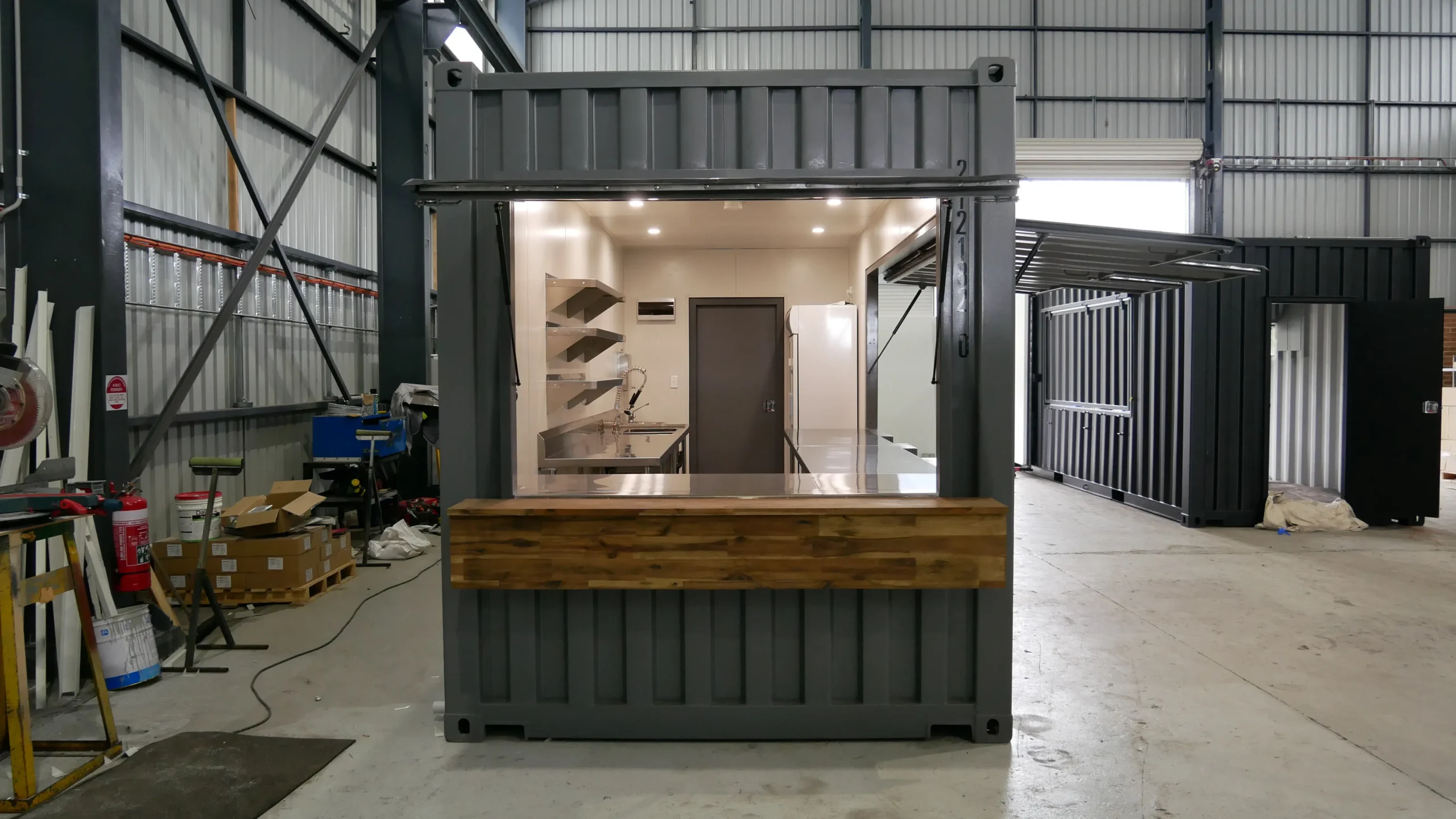 Instagrammable Outdoor Cafe Design Using Modified Containers 10 Custom Cafe with Display Cabinets 3